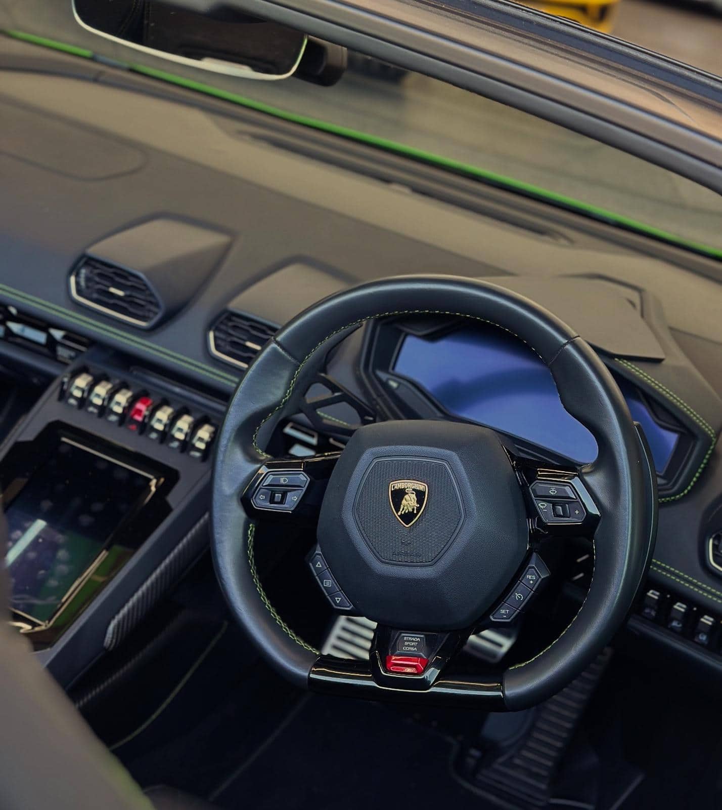 The steering wheel and dashboard of a Lamborghini Huracan